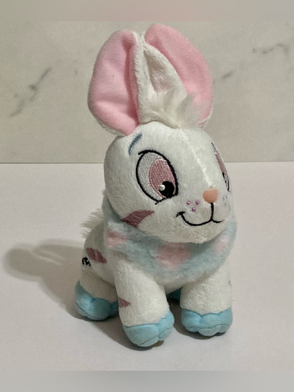 White with blue/pink fur and purple striped Cybunny, 2008 Neopets